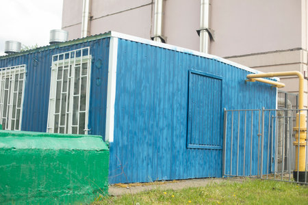Technical building. Boiler room for heating building. Equipment in Blue House. Construction for household needs.の写真素材