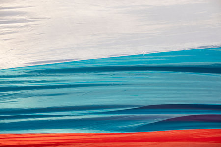 Cloth flag of Russia. Colors of national flag of Russian Federation. Three lanes.の写真素材