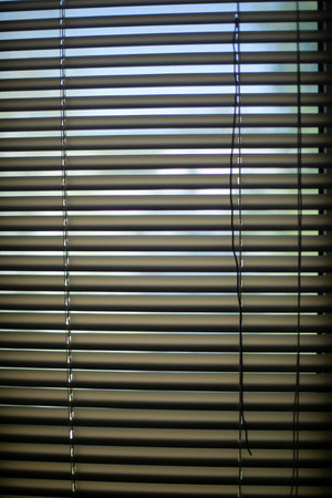 Blinds on window. Window in house. Gleam. Interior details.の写真素材