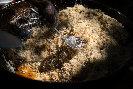 Rice in a pan. Folk food. Oriental cuisine. Pilaf on the street.の写真素材