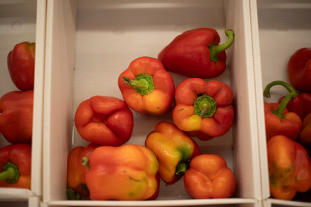 Red pepper in a box. Peppers on the market. Fresh vegetables. Healthy food.の写真素材