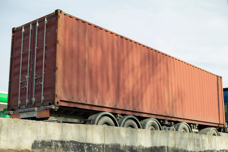 Container on truck. Transportation of goods by road. Large container of red color. Transportation of goods.の写真素材
