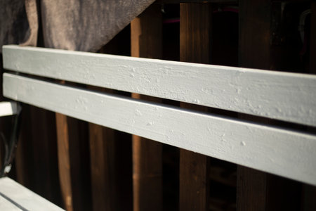 White shop. Empty bench. Furniture on the street. A place to stay in the city.の写真素材