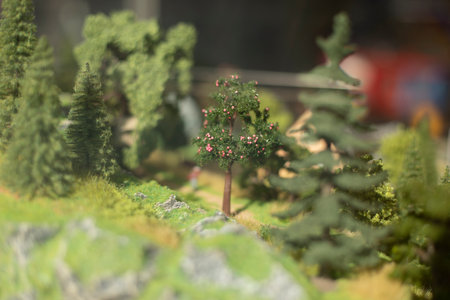 Model of mountainous area. Miniature trees in toy park. Mountain landscape made of plastic. Top view of landscape.の写真素材