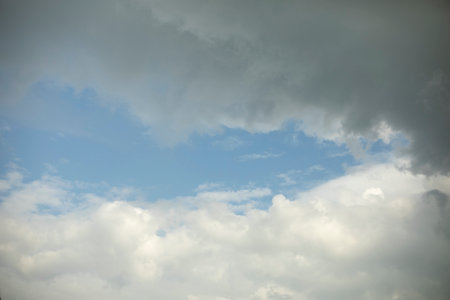 Clouds and sky. Weather before rain. White and gray cloud. Blue lumen.の写真素材