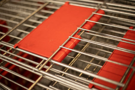Shopping cart in a store. Food basket. Steel cart in a supermarket. Shopping facility.の写真素材
