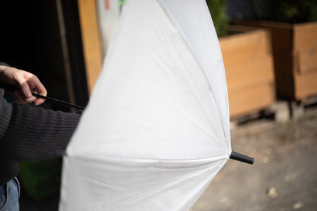 White Parasol. Umbrella made of white material. Sun protection. A Useful Item in Summer.の写真素材