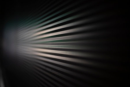 Blinds in the dark. Ribbed wall Horizontal lines texture. Building details in the dark.の写真素材
