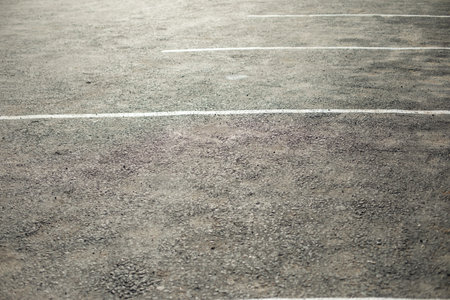 Parking spaces on asphalt. Empty spaces for transport. White markings on asphalt. Street details.の写真素材