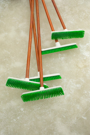 Green Ice Cleaning Brushes. Brushes on ice. Cleaning tool. Winter cleaning equipment.の写真素材