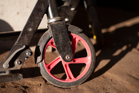 Children's scooter. The wheel of the scooter. Means for skating. Things in the garage.の写真素材