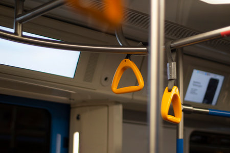 Handrail in the bus. Yellow hand handle. Passenger holder. The interior of the bus.の写真素材