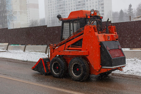 Harvesting equipment. Special transport for cleaning in the city. Orange truck. Vehicle fleet of the...