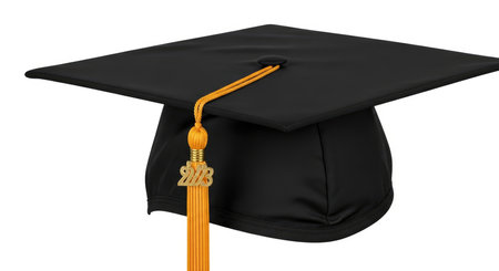 A classic black academic mortarboard hat with a shiny gold tassel, presented against a clean white backdrop, symbolizing achievement.の素材