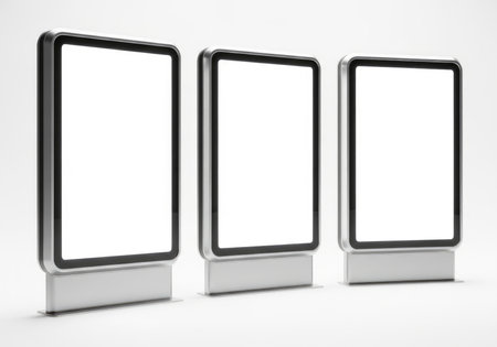 Three modern, vertical blank digital advertising screens, perfect for showcasing your advertisements, promotions, or public information. Isolated for easy integration and customization.の素材