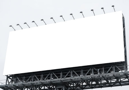 This image features a prominent blank billboard, ready for your custom advertisements. Its vast white surface provides an excellent canvas for marketing messages and brand visibility.の素材