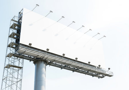 A massive blank white billboard stands isolated, ready for custom advertising campaigns. Perfect for promoting brands, products, and services with impactful messaging and marketing strategies.の素材