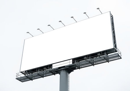 An isolated, massive outdoor advertising billboard with a pristine blank white surface, ready for custom branding, messaging, or promotional content. Ideal for mockups and ads.の素材