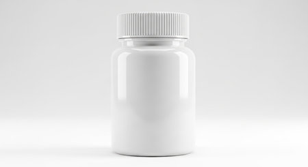 A white plastic bottle with a ribbed cap, isolated on a white background. This image is suitable for use in contexts related to medicine, pharmaceuticals, supplements, or general product packaging.の素材