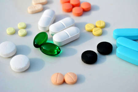 Miscellaneous pills on a white background の写真素材