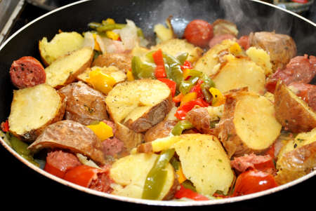 Frying Kielbasa, Potatoes and Peppersの写真素材