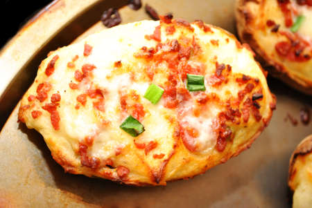 Twice Baked Potato with Cheesy Bacon on a Baking Panの写真素材