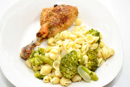 Nutritious Chicken Dinner with Pasta and Broccoliの写真素材