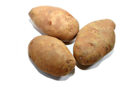Three Whole Potatoes Isolated Over Whiteの写真素材