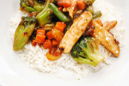 Stir Fried Chicken and Vegetables Served Over White Riceの写真素材