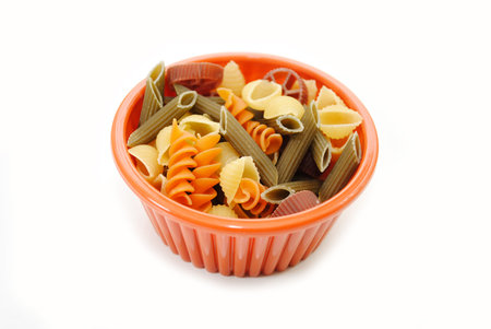 Orange Bowl with Fancy Pasta Isolated on Whiteの写真素材