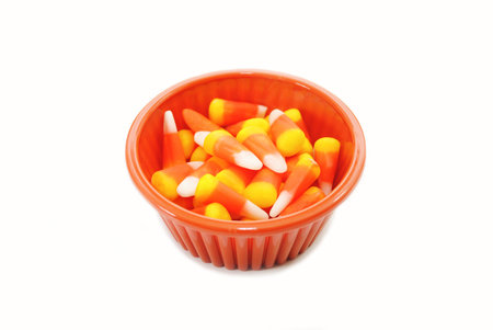 Candy Corn in an Orange Bowl Over White