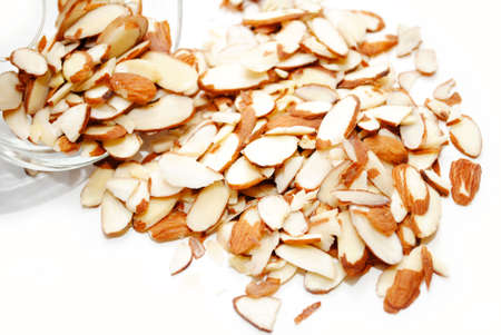 Slivered Almonds Spilled Out of a Glass Bowlの写真素材
