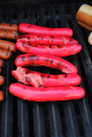 Grilling Summer Hotdogs on a Hot Grillの写真素材