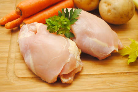Raw Boneless Chicken with Fresh Ingredientsの写真素材