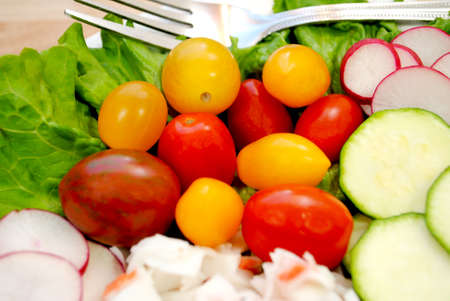 Close-up of Heirloom Tomatoes as Part of a Raw Fresh Saladの写真素材