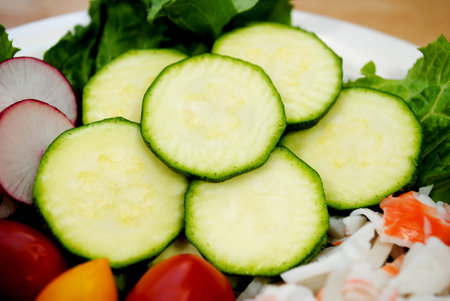 Close-up of Raw Zucchini as Part of a Raw Fresh Saladの写真素材
