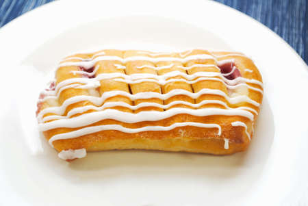 Plated Cherry and Cheese Danishes with Frostingの写真素材