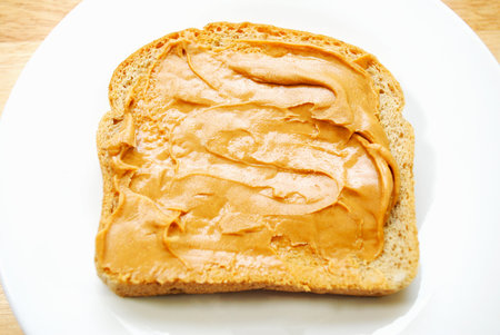 Peanut Butter Spread on Wheat Bread