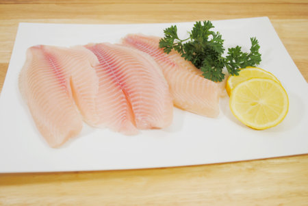 Organic White Fish with Lemon & Parsleyの写真素材