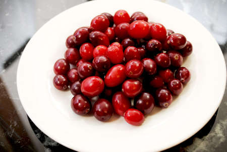 Fresh Whole Cranberries in a White Bowlの写真素材