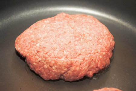 Frying Burgers in a Black Panの写真素材