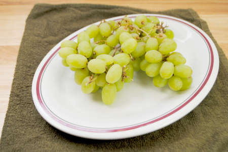 A Snack of Green Grapes on a White Backgroundの写真素材