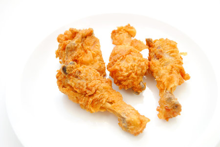 Hot and Spicy Chicken Pieces on a White Plate