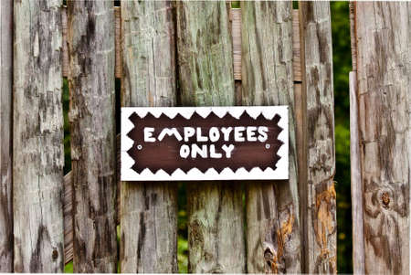 Sign with employees only written on it.の写真素材