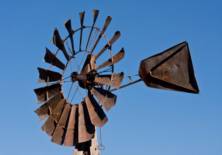 Metal windmill with a  blue sky backgroundの写真素材