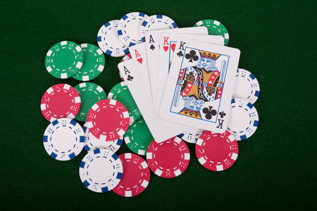 Aces and kings full house on poker chips