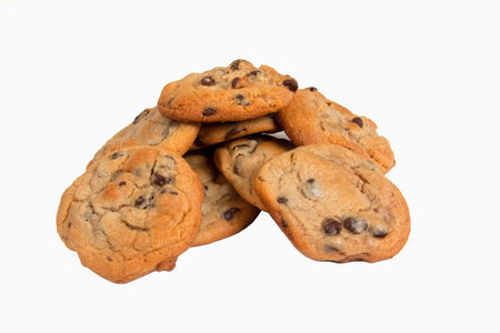 Chocolate chip cookies baked and stacked on a white background