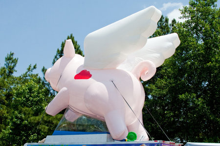 Flying pig on top of a trailerの写真素材