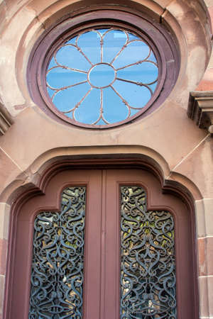 Beautiful architecture featuring ornate doors and windowの写真素材