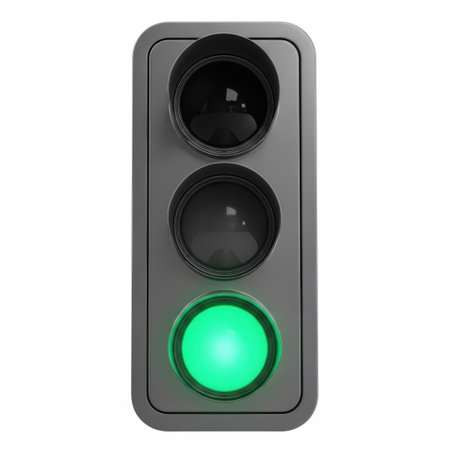 A close-up view of a modern traffic signal displaying a vivid green light. This illuminated signal is ready to direct vehicles, ensuring safe and efficient movement through intersections. The clear green glow symbolizes permission to proceed, a fundamental element of traffic management.の素材
